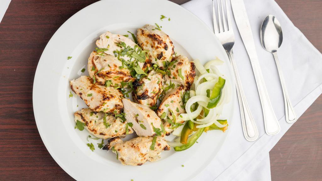 Chicken Malai Tikka · Mouthwatering juicy grilled boneless chicken pieces made with marination of fresh cream, cheese, ginger, garlic, green chili, coriander-stem & mildly seasoned with herbs and spices