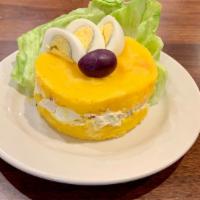 Causa Rellena · Potato dish layered with a filling of chicken or tuna salad.