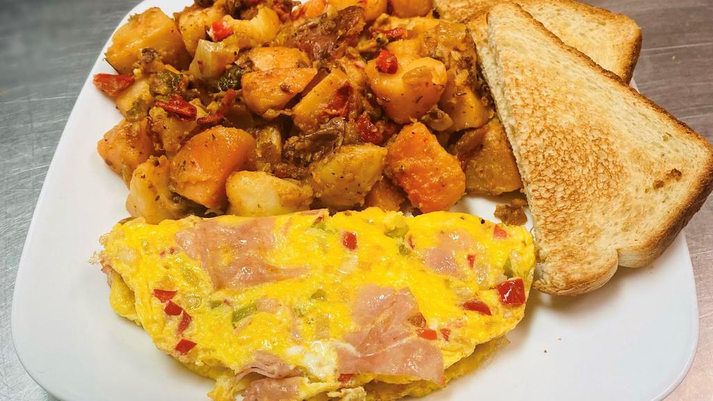 Western Omelette  · 2 scramble eggs, Ham, onion, Pepper, home fries, toast(white or wheat only)
