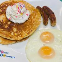 Pancake Platter  · Delicious 2 homemade pancakes with choice of sausage or bacon and two eggs any style!