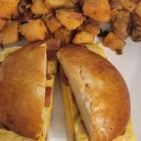 Sandwich Platter · Scramble eggs with cheese, your choice of meat, home fries and white or wheat toast with but...