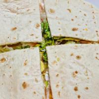 Sincronizada · Ham, tomatoes, lettuce, cheese, avocado and ranch sauce between two flour tortillas.(Extra i...