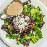 Pecan Salad · mesclun greens and fresh baby arugula Topped with goat cheese, honey roasted pecans, and Cra...