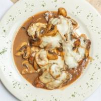 Shrimp Monachino · Breaded shrimp topped with mushroom and melted mozzarella in a brown marsala wine sauce.