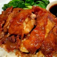 Khao Nar Ped · Crispy roasted duck topped with homemade authentic duck bone gravy, sweeten this with Soybea...
