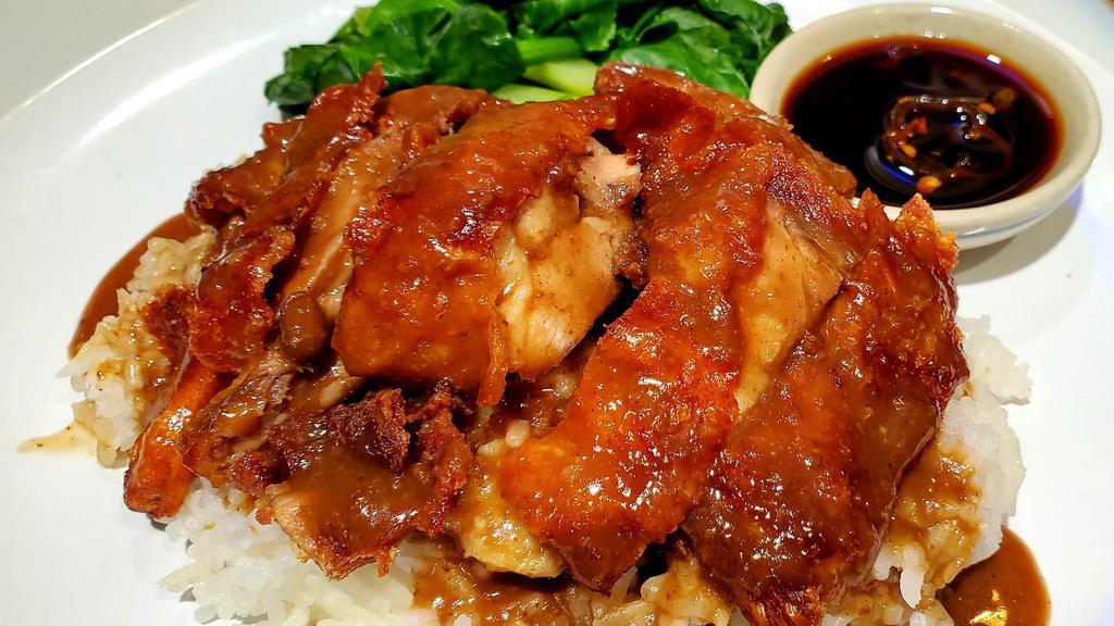 Khao Nar Ped · Crispy roasted duck topped with homemade authentic duck bone gravy, sweeten this with Soybean sauce, bedded on Napa cabbage, served with Thai Jasmine Rice.