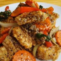 Pla Pad Black Pepper · Fried fillet of red snapper, stir-fried with Thai style fresh garlic, black pepper, carrot, ...