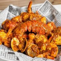 Big Catch · 1/2 Lb Shrimp with head, 1/2 Clam and 7-8 Oz. Lobster tail. Served w/ Corn, Potato & Chicken...