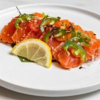 Seared Salmon Tataki · 8 Pcs Sear Salmon w / Cherry Tomato, Jalapeno, Microgreens Topping & Chef Special Sauce.