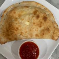 Build Your Own Calzone · Loaded with ricotta cheese and mozzarella served with a side of our homemade marinara.
