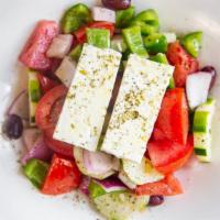 Tomato Salad · Tomatoes, cucumbers, red onions, green peppers, olives, and feta cheese.
