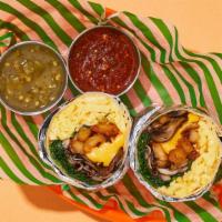 Veggie Spinach And Mushroom Breakfast Burrito · Two scrambled eggs with crispy home fries, melted cheese, spinach, and mushrooms wrapped up ...