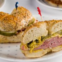 Off The Wall · A hot Cuban.  Ham, Swiss cheese, pickles, and hot mustard.