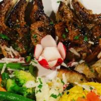 Grilled Lamb Chops / Costeletas De Borrego · Served with Rice, Vegetables, and Cooked Onions.