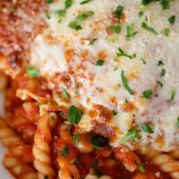 Chicken Parma · Traditional baked with marinara and fresh mozzarella.
served over spaghetti