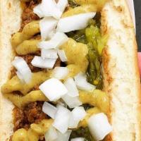 Hot Dog Complete · Hot dog with chili, relish, mustard and raw onions.