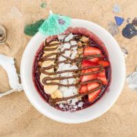 Sunset Bowl · Blended acai topped with banana, strawberry, granola, coconut shavings and nutella.