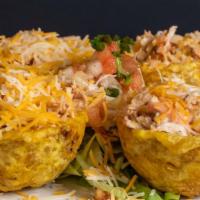 Mix Mofonguitos · Shredded chicken breast with ground beef. Cover with Shredded cheddar cheese