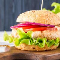 1/2 Lb. Deluxe Turkey Burger · A delicious burger with a turkey patty, pickles, tomatoes, and lettuce between warm toasted ...