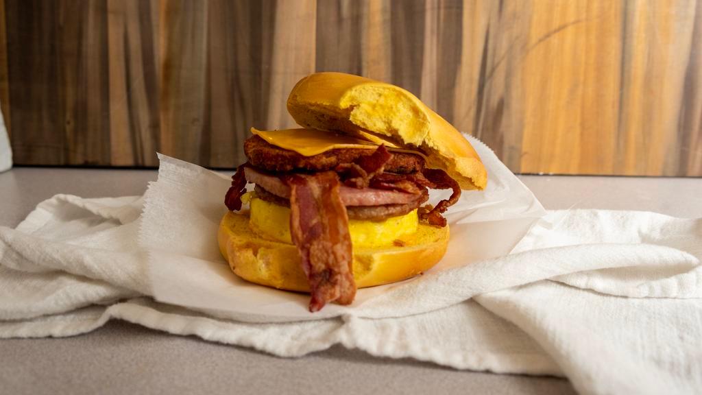 Bordentown Bagel Buster · Scrambled Eggs, Cheese, Bacon, Sausage, Pork roll, and a hash brown, all on a bagel of your choice!
