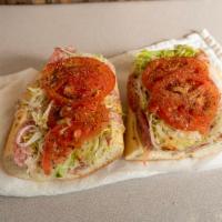 Italian Hoagie · Ham, capicola, and provolone cheese on a torpedo roll. Does not come with toppings- add lett...