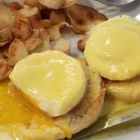 Eggs Benedict · 2 Poached Eggs served over an English Muffin with Canadian Bacon topped with Hollandaise Sau...