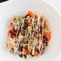 Takoyaki · Octopus-filled fried fritters, kewpie mayo, okonomi sauce, aonori, and bonito flakes.
