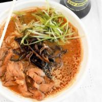 Miso Ramen · Vegan miso broth, braised chicken, wood ear mushrooms, cabbage, and green onions