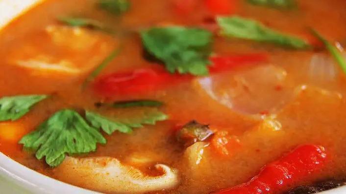 Tom Yum Chicken  · Spicy Shrimp Broth, mushroom, tomato, onion, pepper, coconut milk