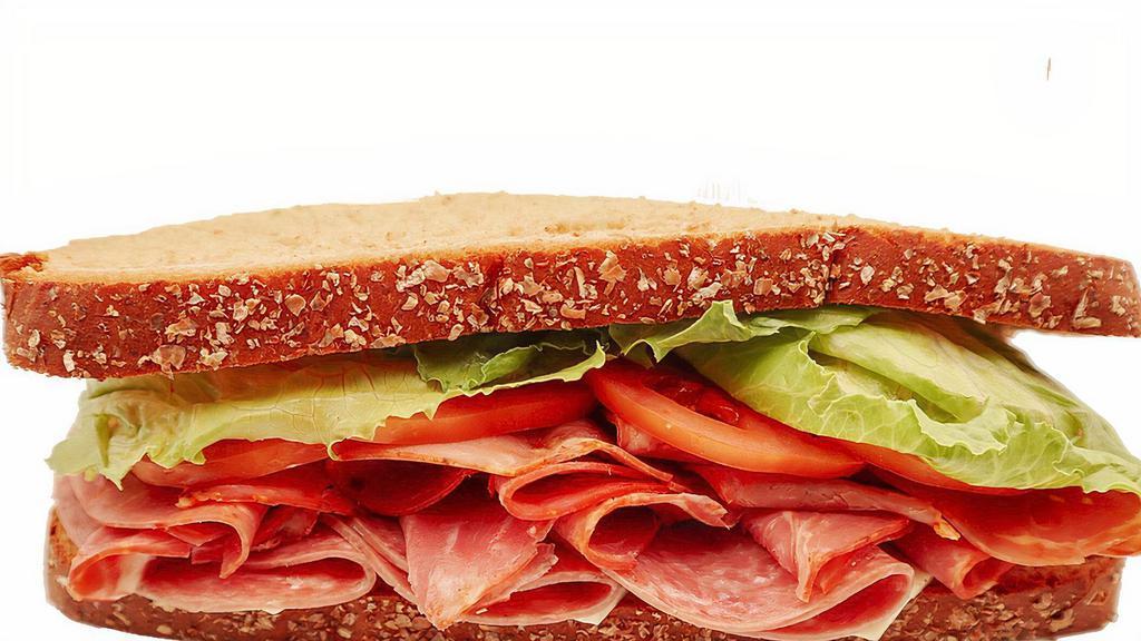 Whole Italian Giant Deli Sandwich · Our Italian Giant Deli sandwich features freshly sliced premium salami and capicola piled high on your choice of New York Bakery bread. Add your favorite toppings and enjoy!
