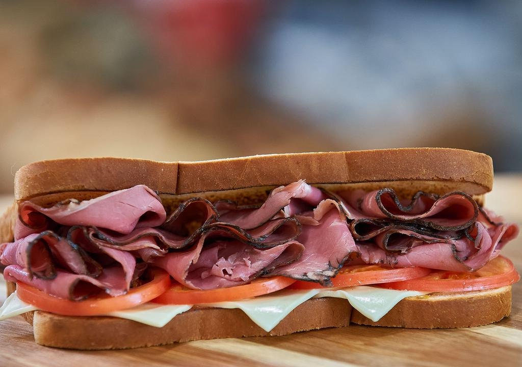 Whole Keegan Giant Deli Sandwich · Can't decide? Try our delightful freshly-sliced roast beef on New York Bakery white bread topped with American cheese, Hellman's mayo and tomatoes.