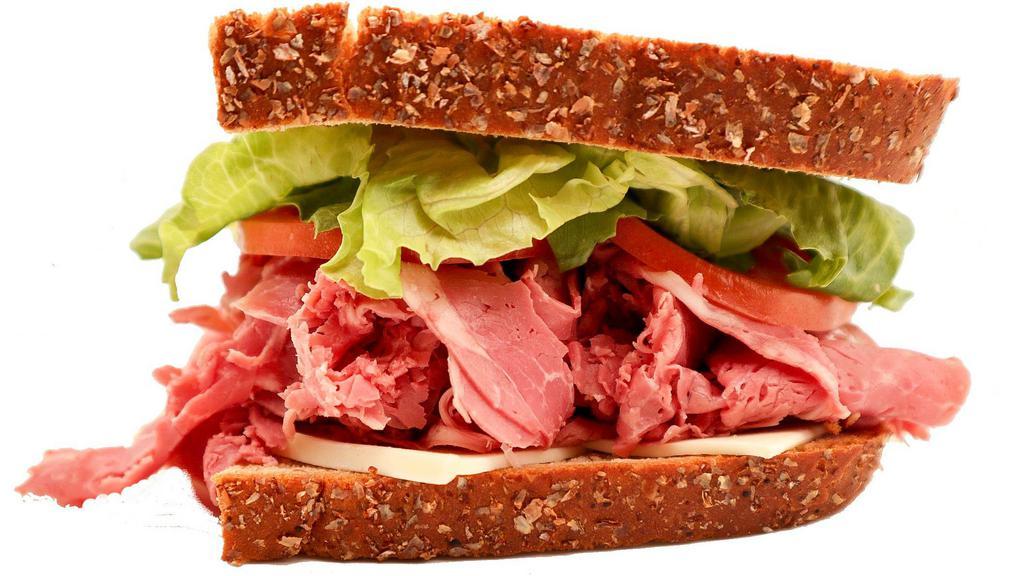 Half Corned Beef Giant Deli Sandwich · Mix things up with the Corned Beef Giant Deli sandwich. Topped with freshly sliced corned beef, your choice of New York Bakery bread, toppings, cheese and sauce!