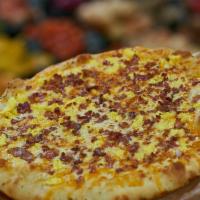 Breakfast Pizza · A breakfast like no other! Scrambled eggs with shredded cheddar and mozzarella cheeses. Your...