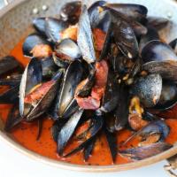 Mussels Espagnole · Chorizo (Spanish sausage), garlic confit, smoked tomato sauce.