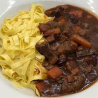 Tagliatelle Boeuf Bourguignon · Braised beef, root vegetables, bacon, tagliatelle pasta, red wine reduction.