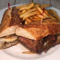 Sandwich Bouchere · Sliced Filet Mignon, mozzarella, pickled red onions, baguette (served w French Fries)