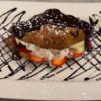 Croissant Au Chocolat · Croissant stuffed with vanilla custard, ice cream, berries. Chocolate and raspberry sauce