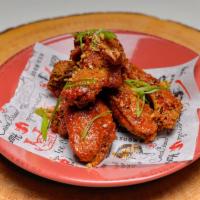 Wild Wild Wings · Ginger-black pepper sauce and scallion.