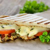 Colonial Panini · Panini filled with chicken cutlet, mozzarella cheese, lettuce, tomato and 1000 island dressi...