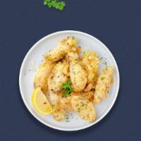 Guardians Of Garlic Parmesan Vegan Wings · Fresh vegan wings breaded, fried until golden brown, and tossed in garlic and parmesan. Serv...