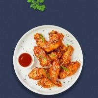 In Between Sweet And Sour Vegan Wings · Fresh vegan wings breaded, fried until golden brown, and tossed in sweet and sour sauce. Ser...