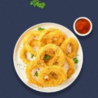Lord Of The Onion Rings · Sliced onions dipped in a light batter and fried until crispy and golden brown.