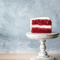 Red Velvet Cake · Three moist layers of stunning red velvet filled and topped silky cream cheese icing.