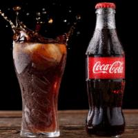 2 Liters Coca-Cola · Size: 2 Liters