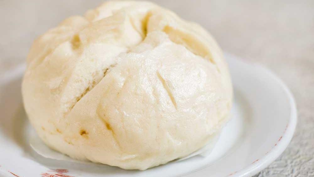 House Special Roast Pork Bun · Steamed wheat flour bun filled with pork and caramelized onions.