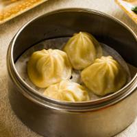 Chicken Soup Dumplings · 4 pieces of chicken filled dumplings filled with broth