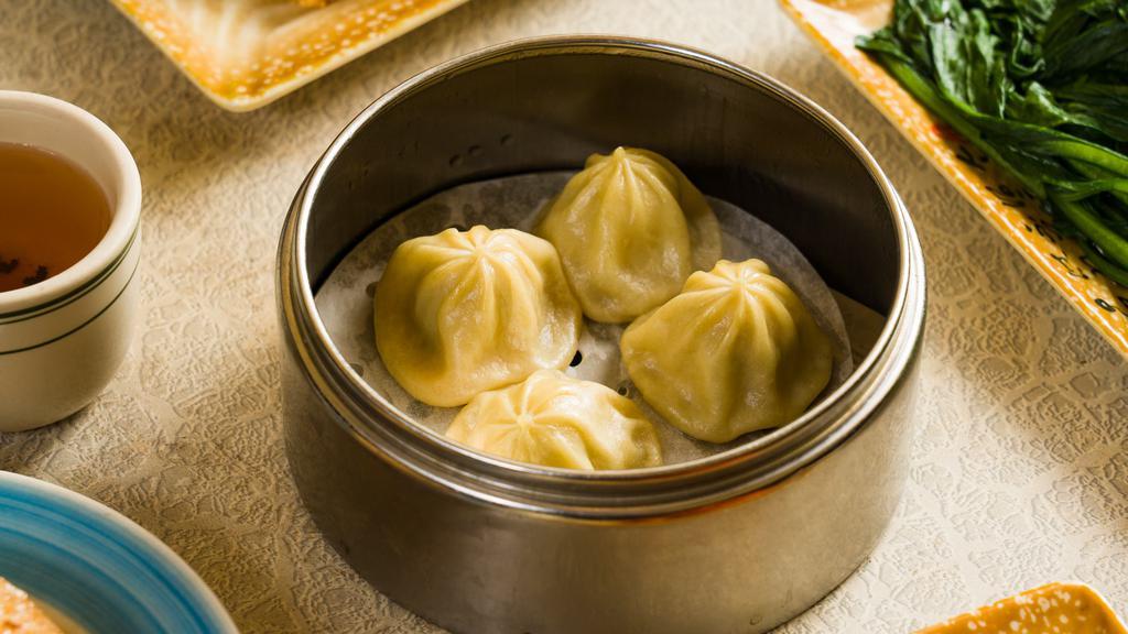 Chicken Soup Dumplings · 4 pieces of chicken filled dumplings filled with broth