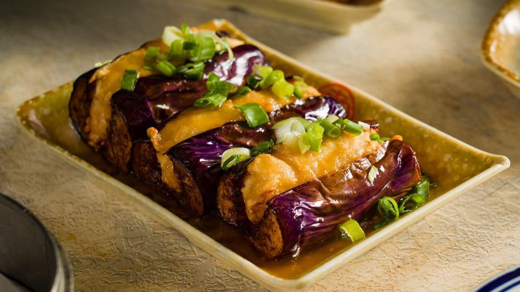 Stuffed Eggplant · 3 pieces of eggplants stuffed with deep fried shrimp paste and served with brown sauce and scallions. (Gluten-free)