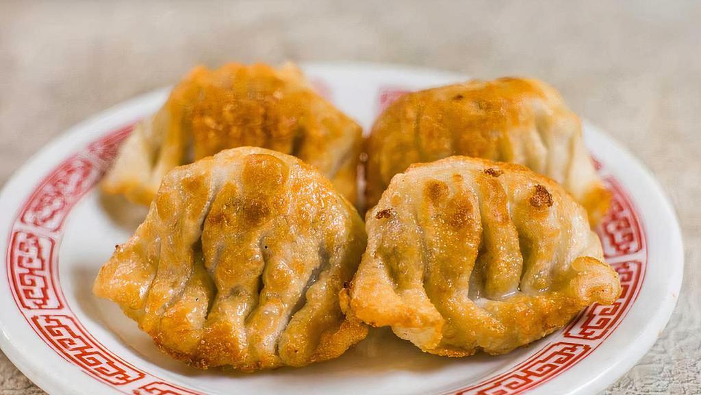 House Special Pan Fried Dumplings · 4 pieces of pork and shrimp dumpling in a home-made wheat wrapper and pan fried.