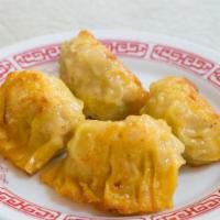 Pan-Fried Chicken & Cabbage Dumplings · 4 chicken and napa cabbage dumplings